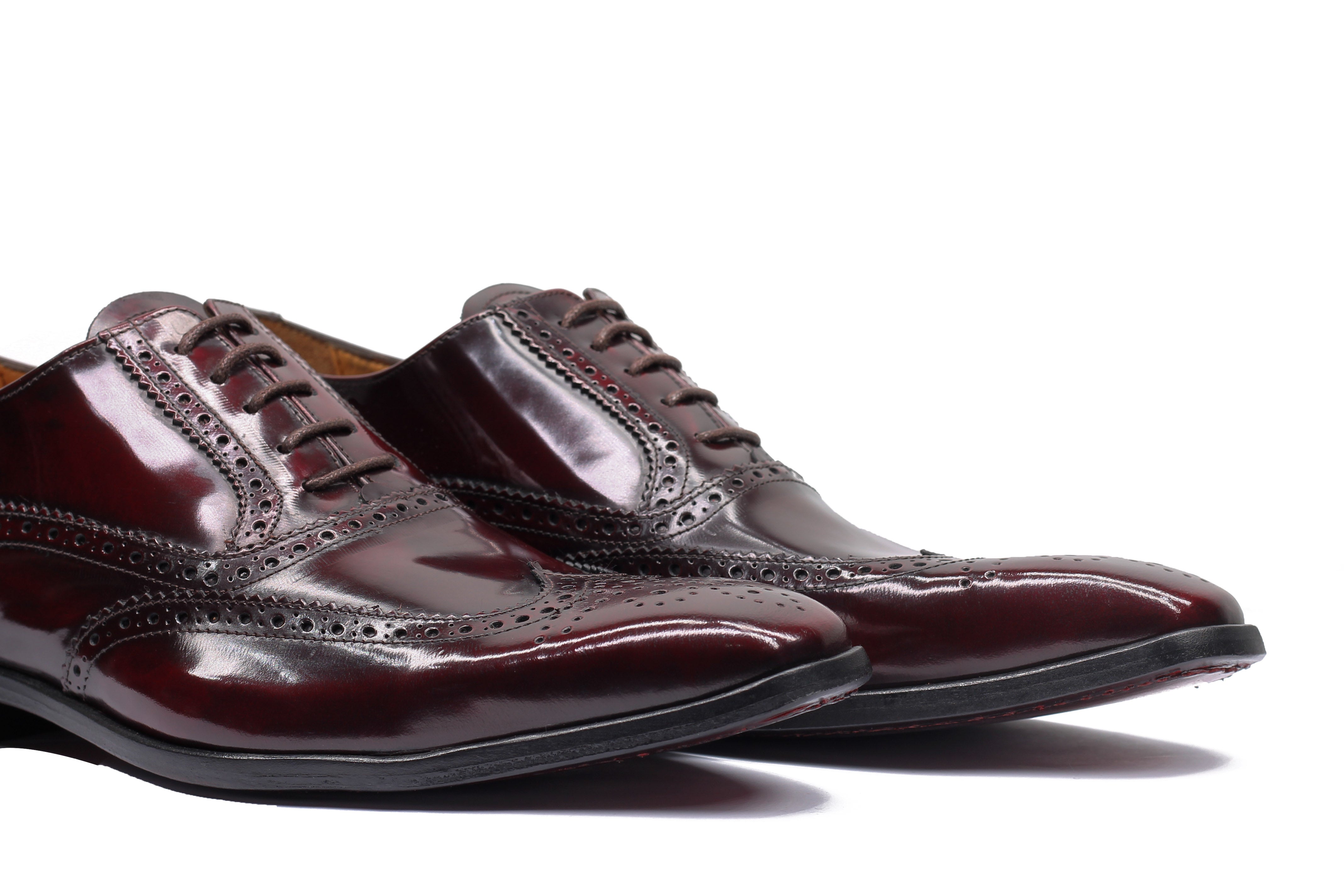 POLISHED CALF LEATHER BROGUES IN BURGUNDY
